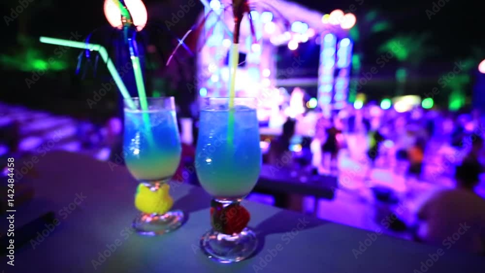 colourfull night club background with coktail glass colourfull night club background with coktail glass