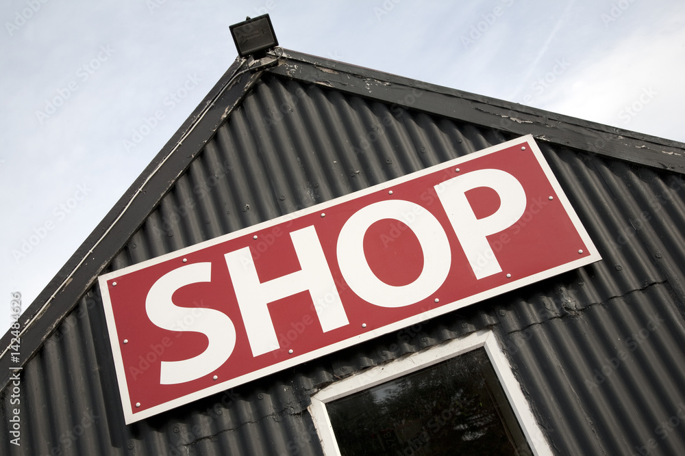 Shop Sign on Building Facade on Diagonal Angle Slant Shop Sign on Building Facade on Diagonal Angle Slant