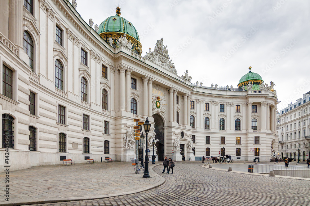 Cloudy view of Hofburg Palace at Michaelerplatz, Habsburg Empire landmark in Vienna, Austria.
