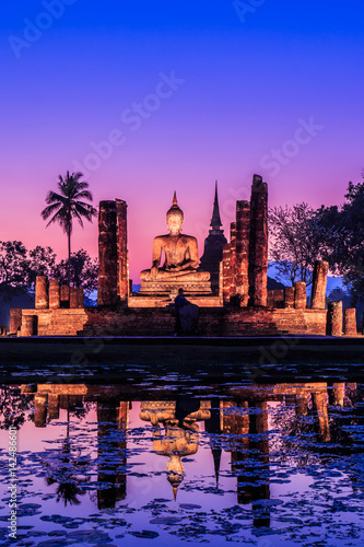 Buddha with twilight at Sukhothai historical park, the old town of Thailand