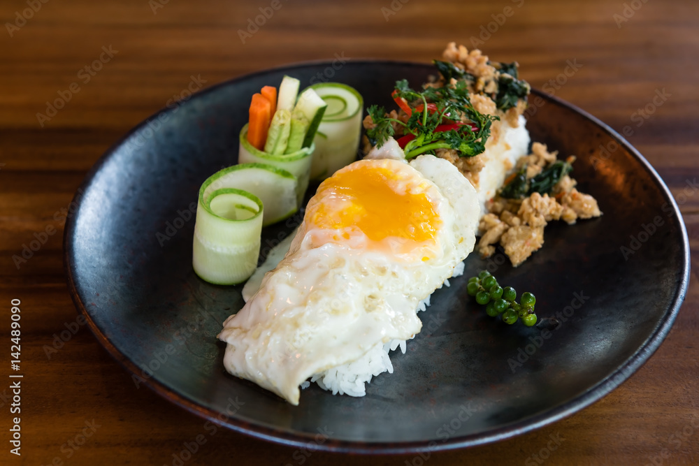 thai style stir fried minced chicken with sweet basil over rice thai style stir fried minced chicken with sweet basil over rice