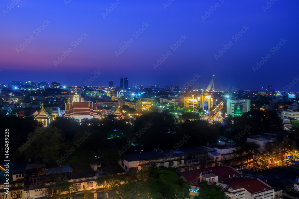 Cityscape view of bangkok under pink and blue sky.