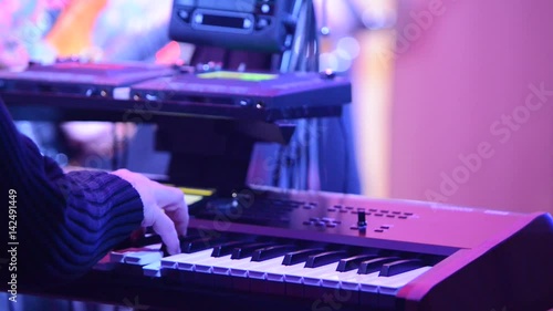 Detail Of Piano Player At A Rock Concert photo