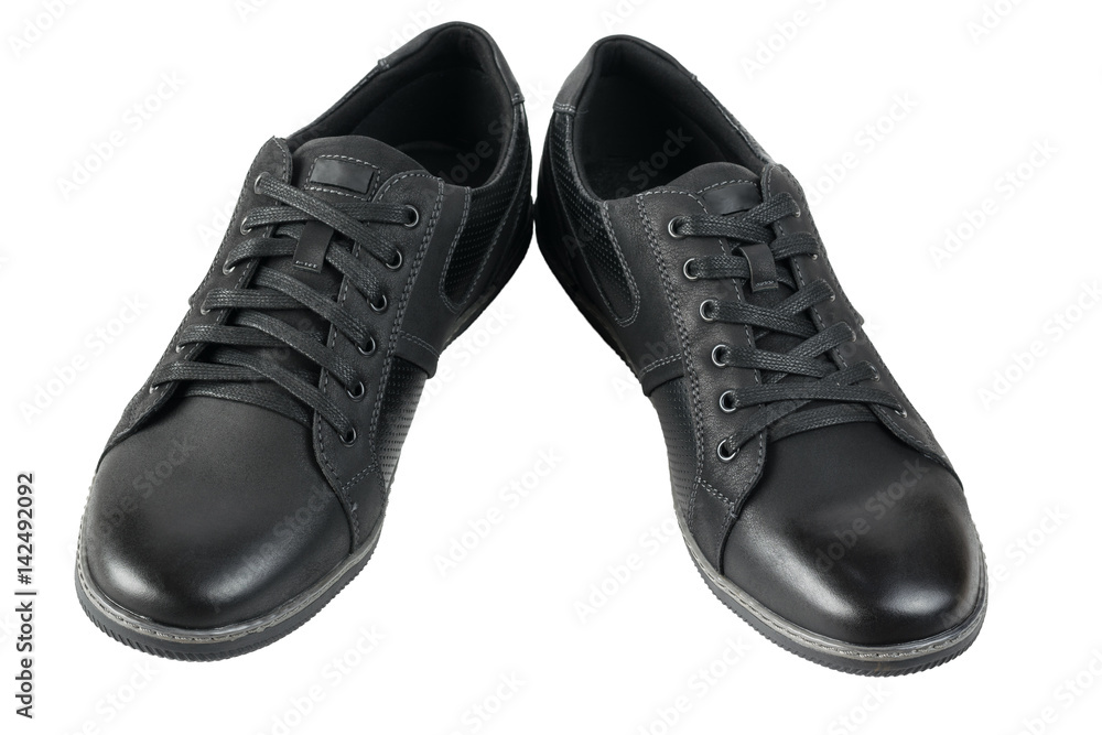 Pair of athletic black mens shoes isolated on white background. Pair of athletic black mens shoes isolated on white background.