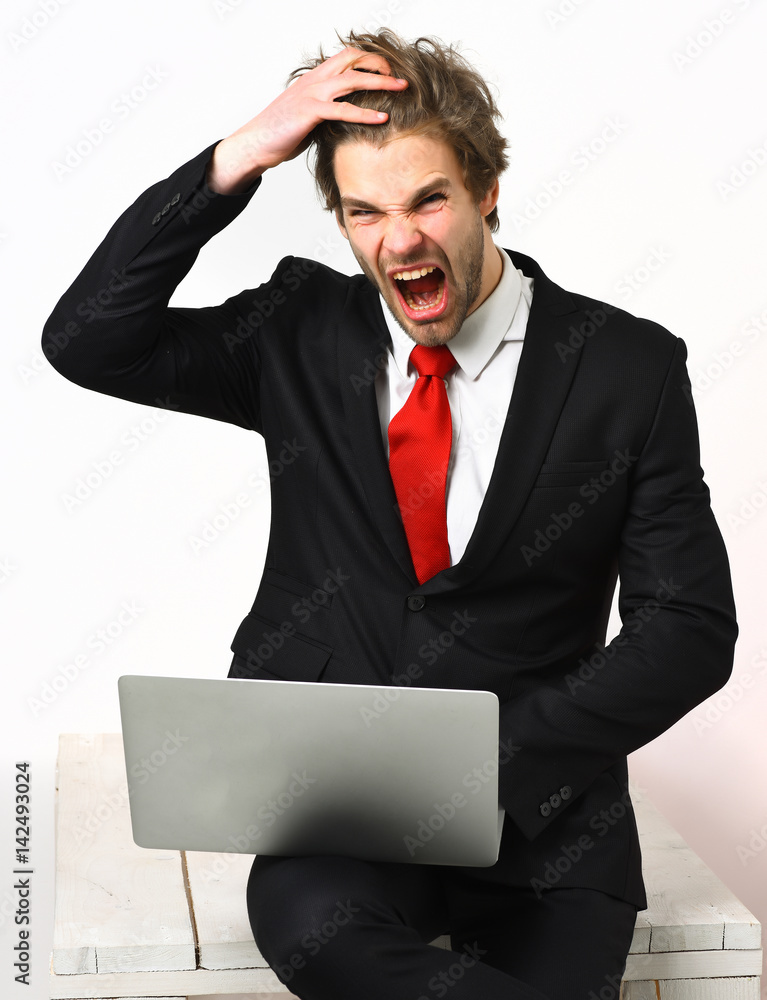 Caucasian stylish business man holding laptop Caucasian stylish business man holding laptop
