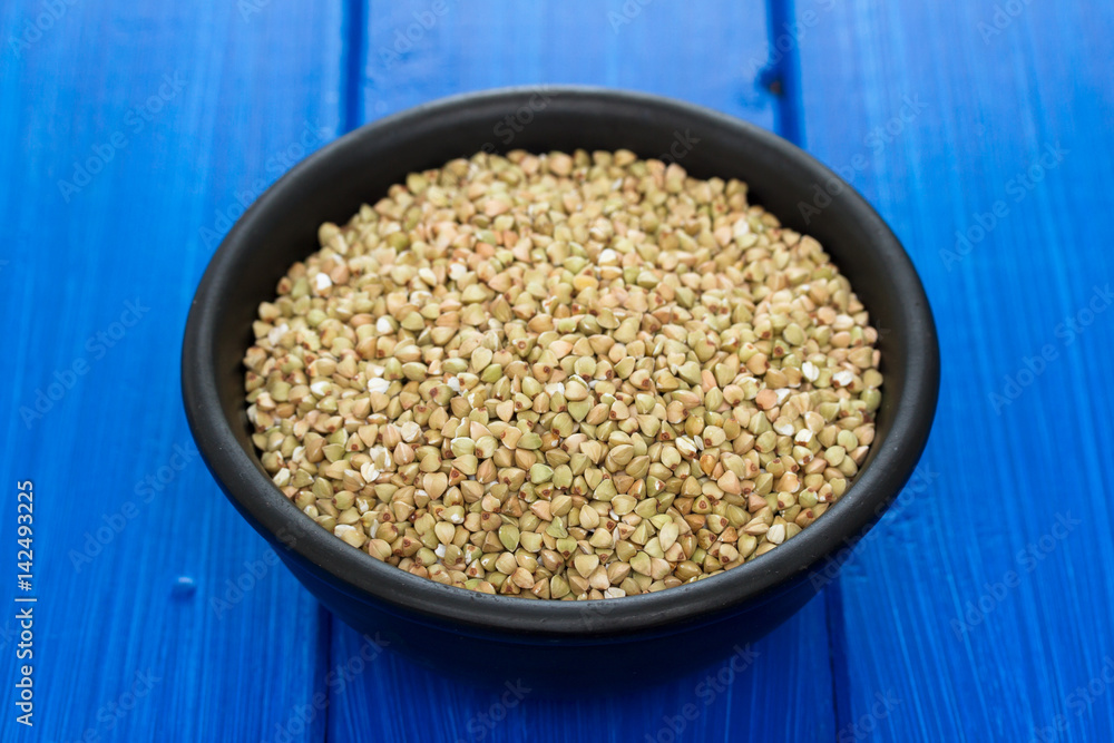green buckwheat in black bowl green buckwheat in black bowl