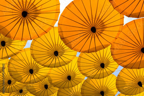 many decoration with hanging yellow umbrella outdoor