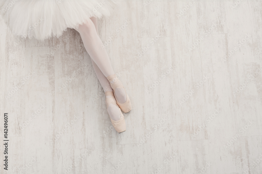 Ballerina in pointe ballet shoes, graceful legs with copy space Ballerina in pointe ballet shoes, graceful legs with copy space