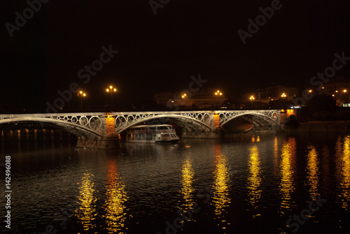 Triana bridge in summer,Seville,Spain © corradobarattaphotos