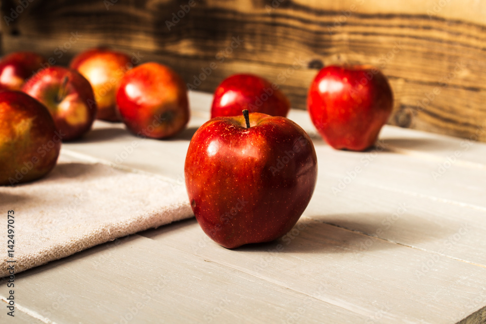 red apples on wooden background red apples on wooden background