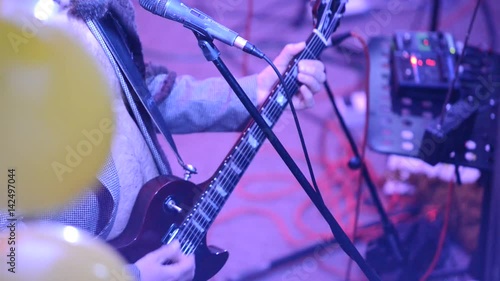 Detail Of Guitarist At A Rock Concert photo