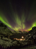 Aurora borealis (Polar lights) over the mountains in the North of Europe - Senja island, Troms county, Norway
