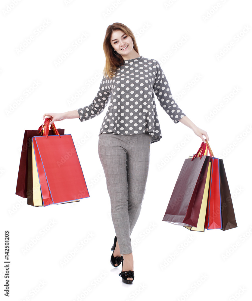 Young brunette woman with some shopping bags