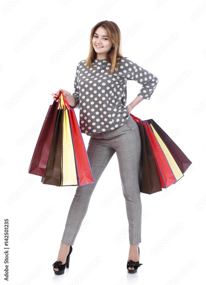 Young brunette woman with some shopping bags Young brunette woman with some shopping bags