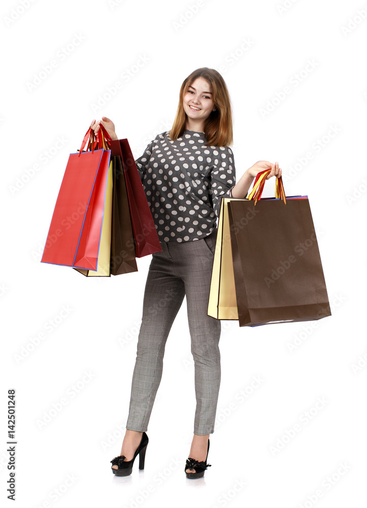 Young brunette woman with some shopping bags