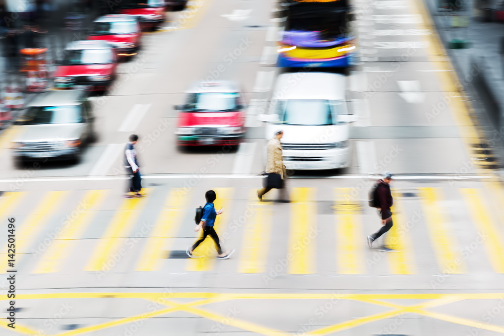 people crossing a street in Hongkong