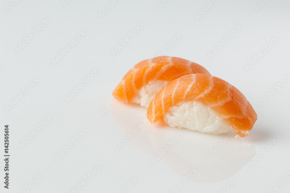 close up of sushi with rice on white background with reflection close up of sushi with rice on white background with reflection