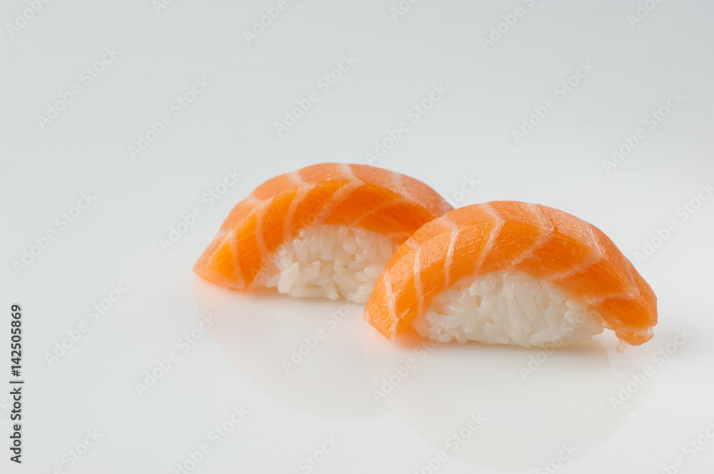 close up of sushi with rice on white background with reflection close up of sushi with rice on white background with reflection