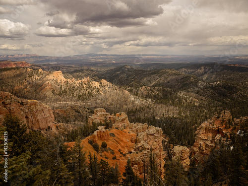 Bryce Canyon National Park, a sprawling reserve in southern Utah, is known for crimson-colored hoodoos, which are spire-shaped rock formations.