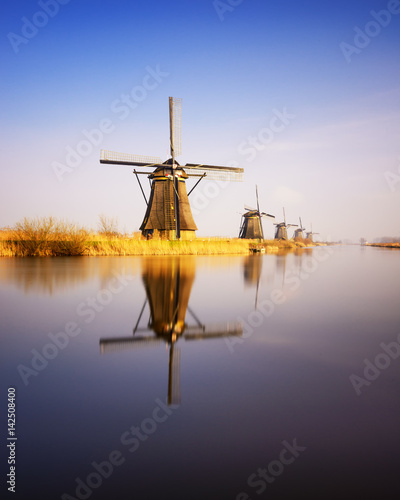 Sunset view at typical windmill at Kinderdijk, Holland.