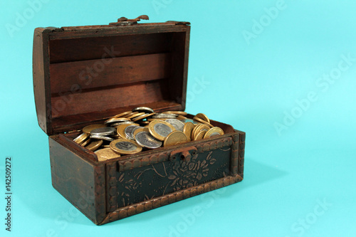 Brazilian coins inside the wooden chest