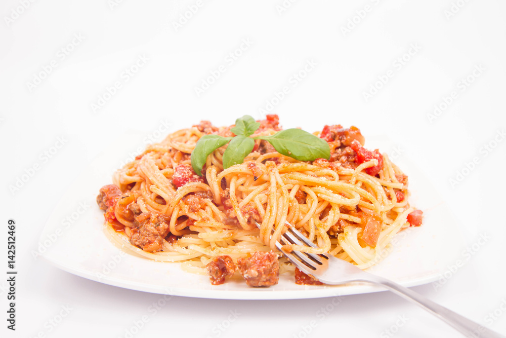 Spaghetti bolognese being eaten with a fork Spaghetti bolognese being eaten with a fork