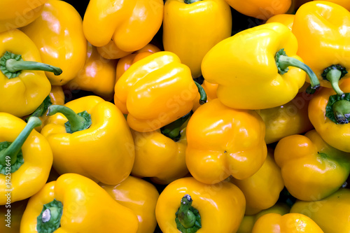 Bunch of yellow peppers in a greengrocery
