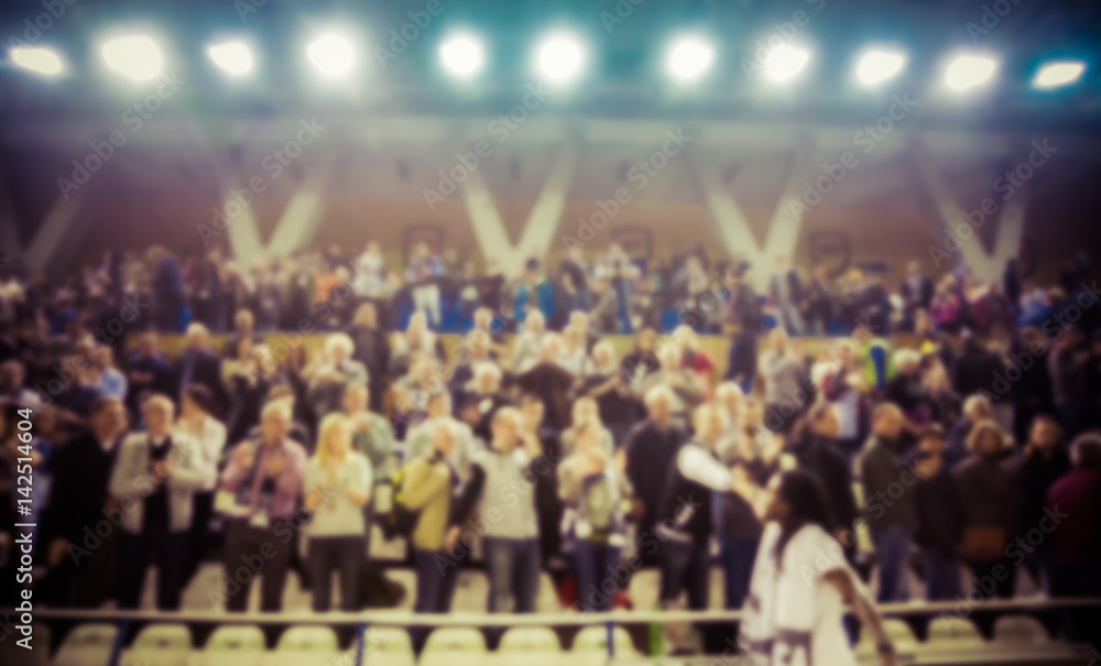 Naklejka premium blurred background of crowd of people in a basketball court