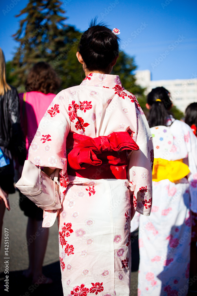 Woman in summer kimono dancing at Obon