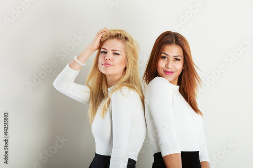 Blonde and dark friends together.