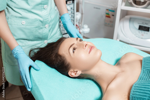 young brunette woman waiting for Spa treatment in Spa salon. cosmetology