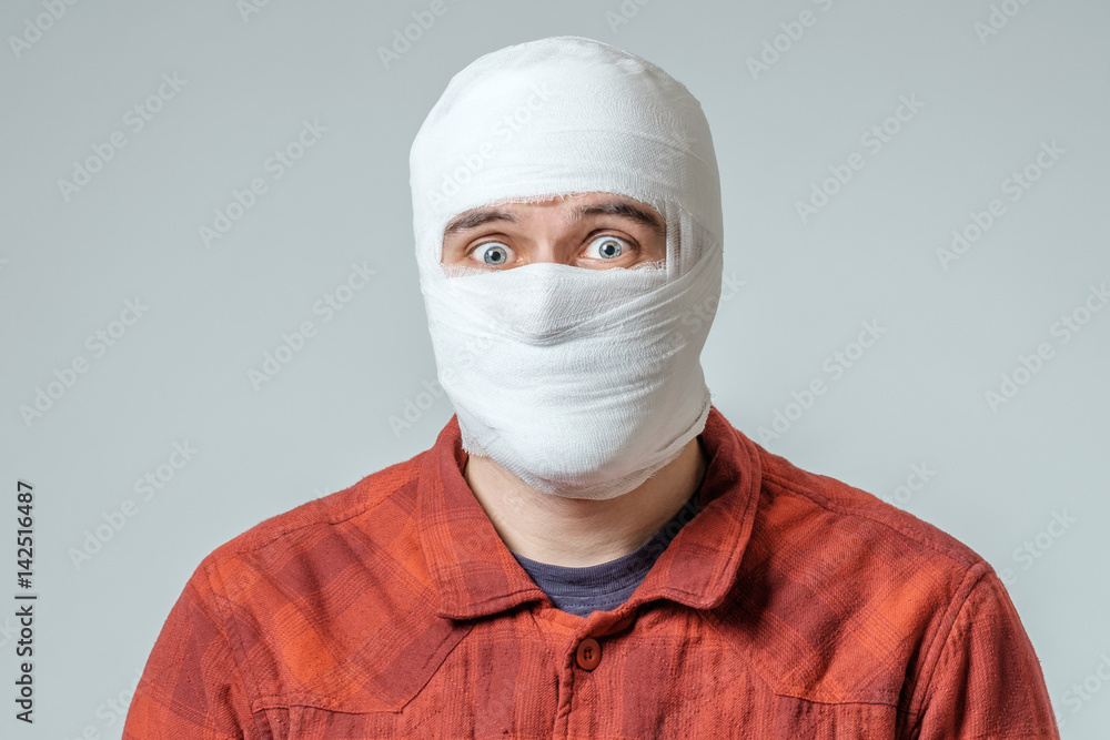 Portrait of man bandaged up Portrait of man bandaged up