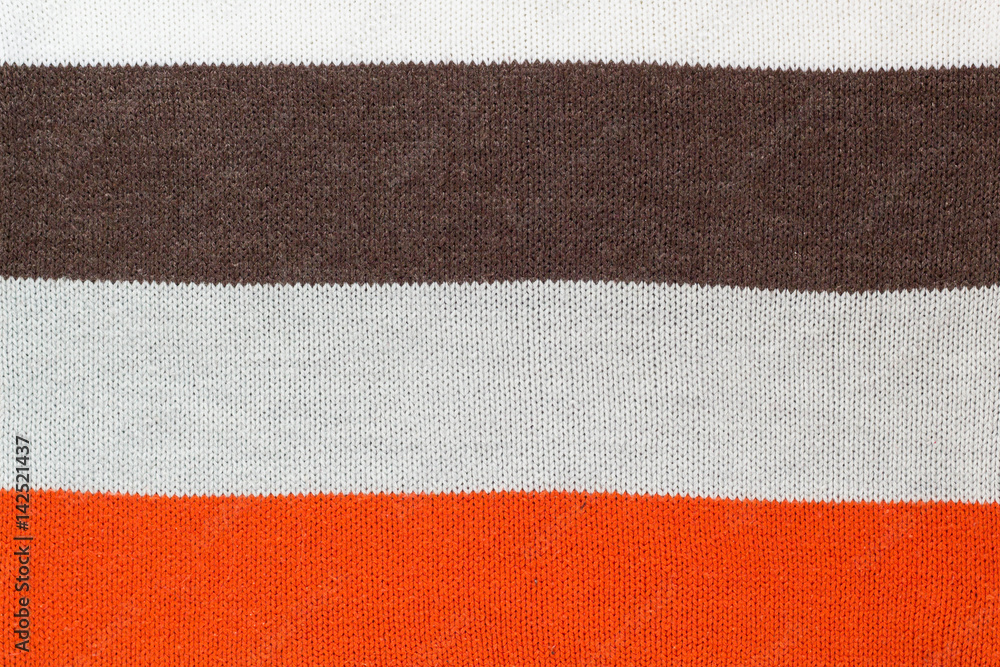 Fototapeta premium sweater thread texture background ,Multicolor front loops of wool yarn knitted background
