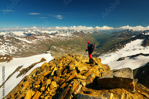 Tourist on Similaun Peak, Ötztal Alps, Austria photo