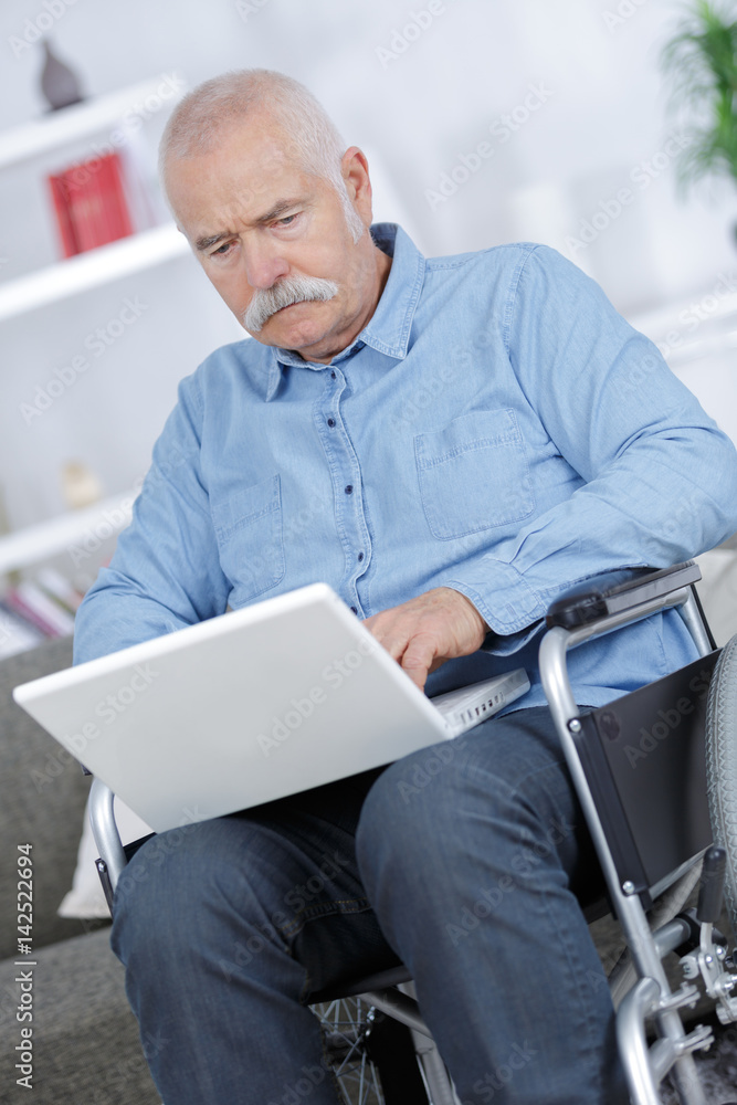 retiree using a laptop retiree using a laptop