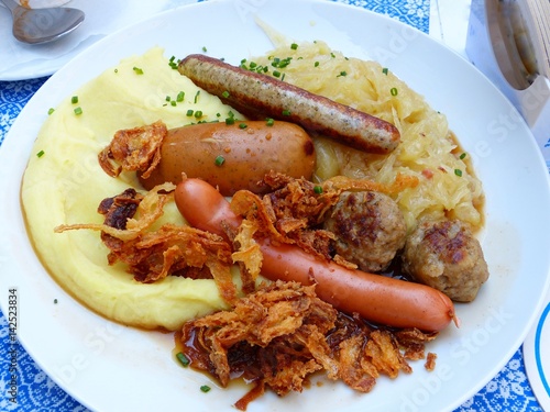 Sausages with sauekraut and mashed potatoes. photo