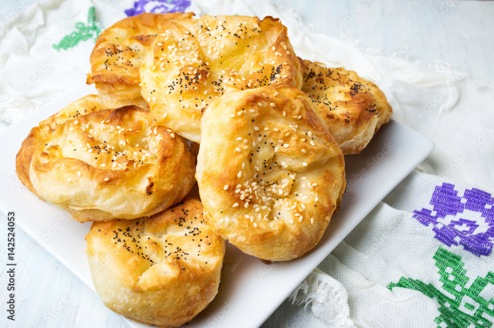 Homemade cheese pie rolls covered with sesame Homemade cheese pie rolls covered with sesame