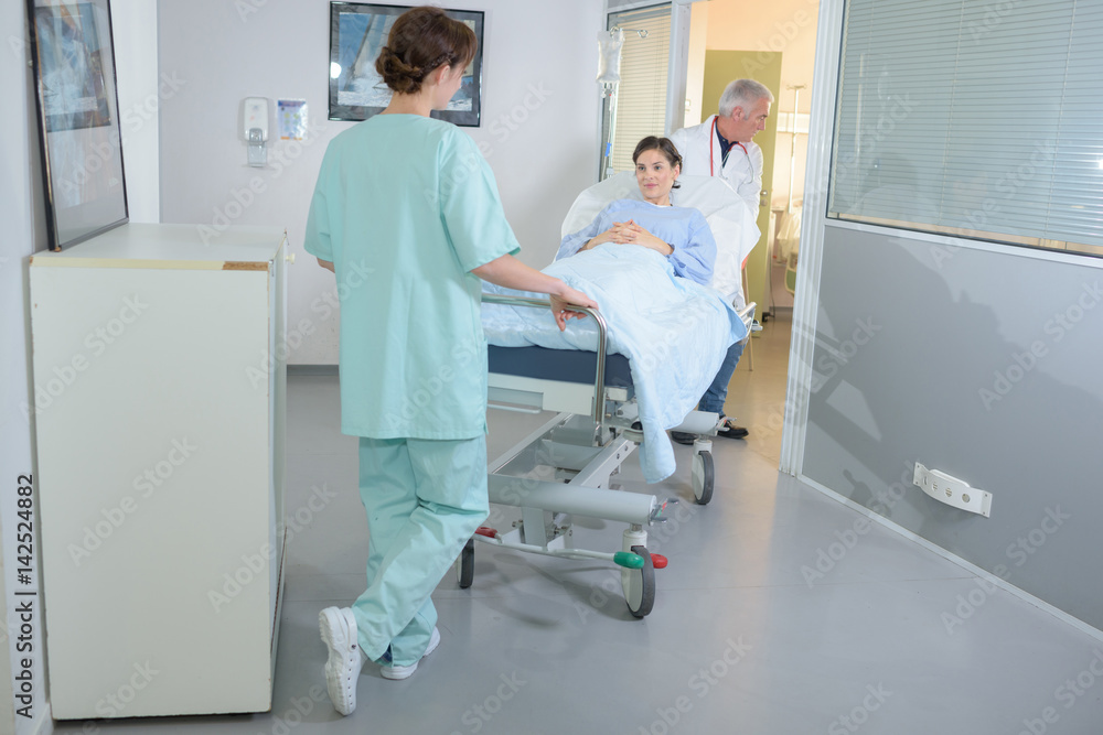 Obraz premium Patient being wheeled on hospital stretcher