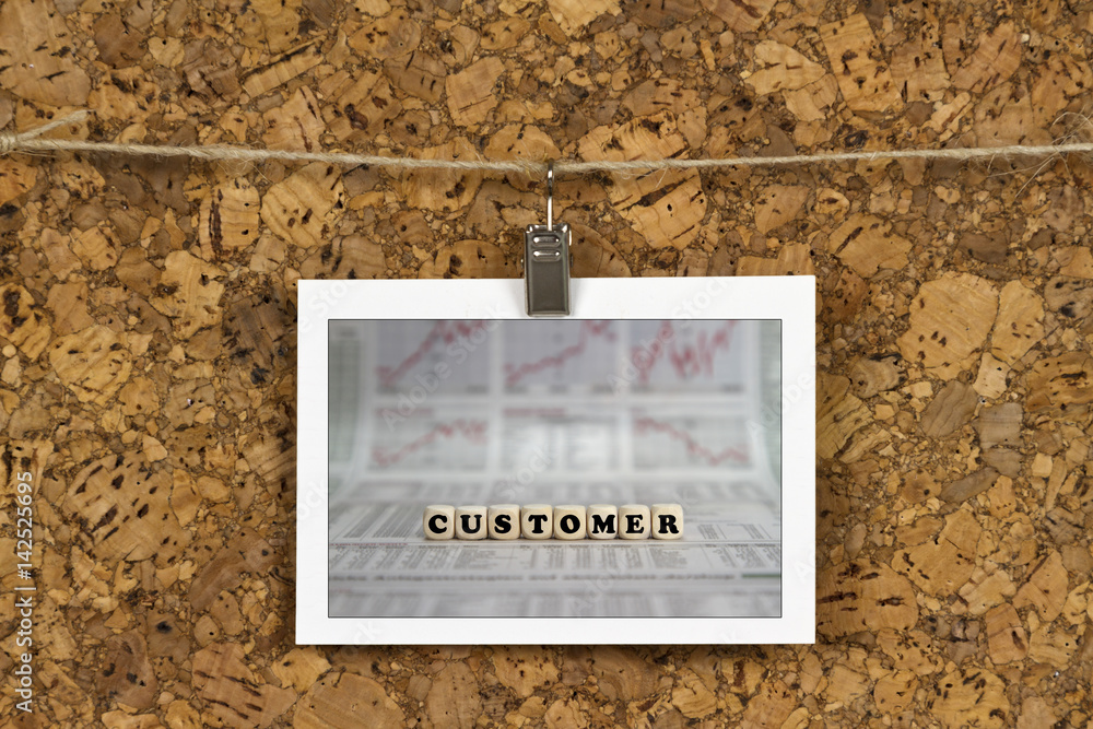 Fototapeta premium Customer word on business card pinned up on cork board