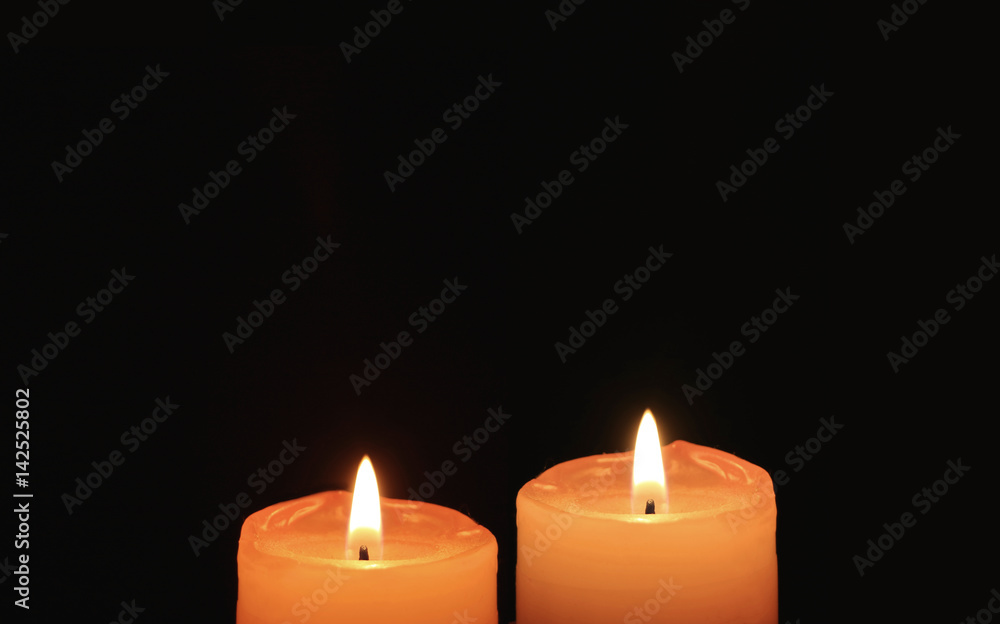 Burning Pair of Orange Candles On Black Background Burning Pair of Orange Candles On Black Background