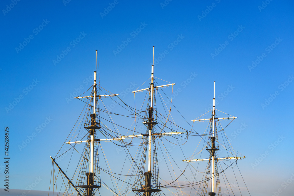 ship's mast against a backdrop of blue sky