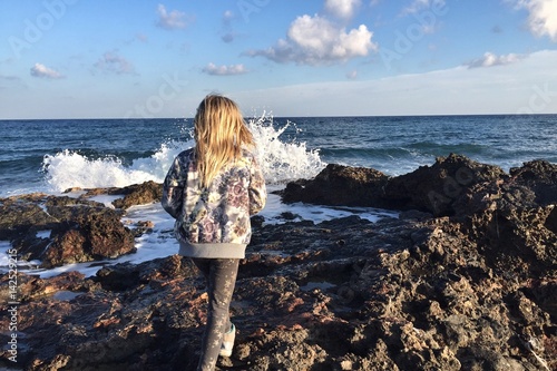 girl walking on rocks