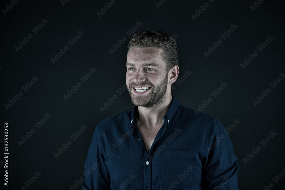 handsome happy man with unshaven face in blue fashionable shirt handsome happy man with unshaven face in blue fashionable shirt