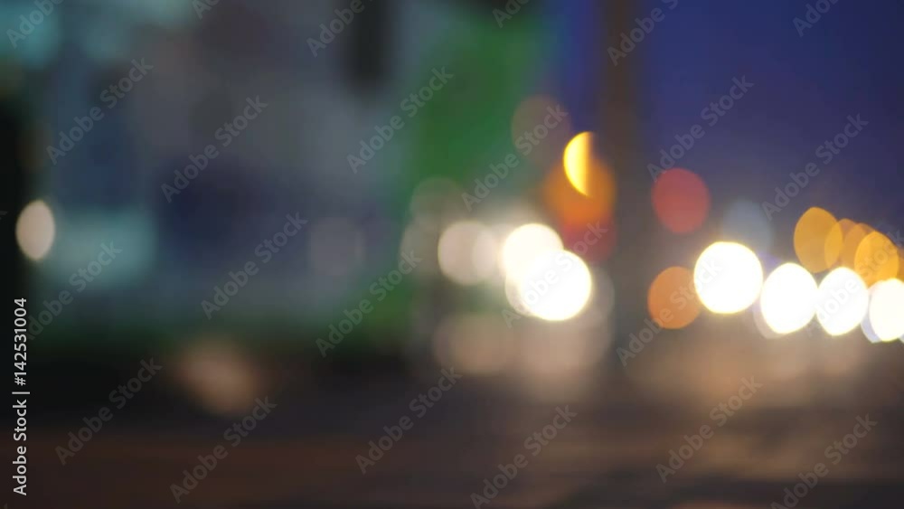 Colorful traffic lights bokeh circles on night city street. Abstract background Colorful traffic lights bokeh circles on night city street. Abstract background