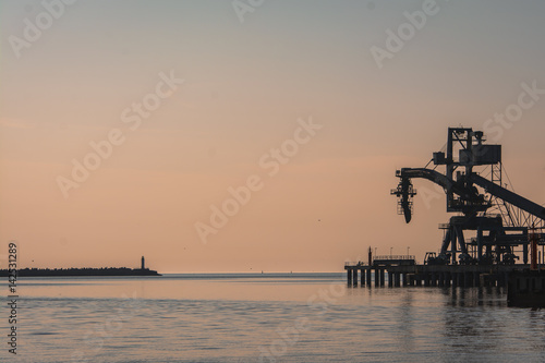 Ship loader sunset silhouette