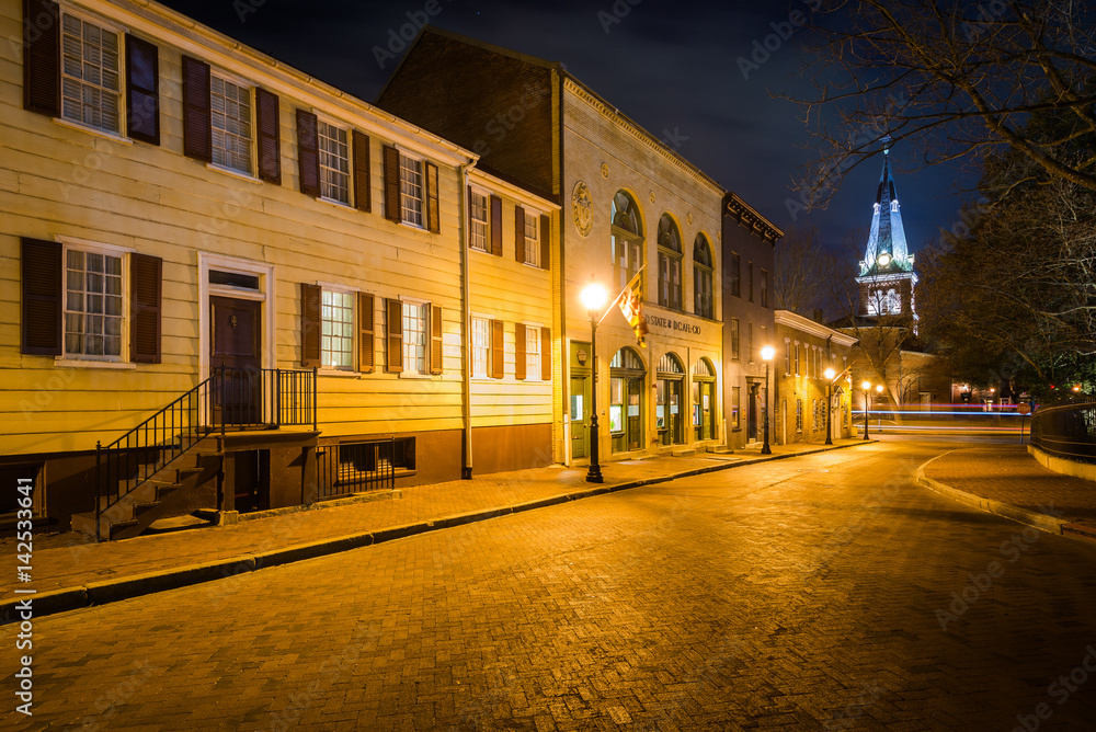 Buildings on School Street and St. Anne's Parish at night, in Annapolis, Maryland.
