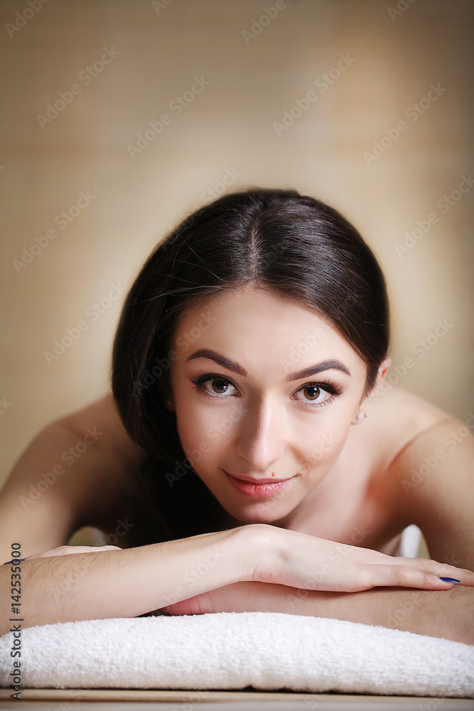 Body Care. Spa Woman. Beauty Treatment Concept. Beautiful Healthy Caucasian Girl Relaxing On Massage Table Before Hand Massage On Relaxed Back In Health And Spa Salon. Skin Care, Wellness, Lifestyle Body Care. Spa Woman. Beauty Treatment Concept. Beautiful Healthy Caucasian Girl Relaxing On Massage Table Before Hand Massage On Relaxed Back In Health And Spa Salon. Skin Care, Wellness, Lifestyle
