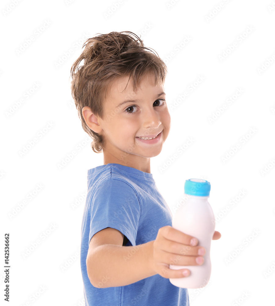 Kid in blue shirt holding plastic bottle of milk on white background Kid in blue shirt holding plastic bottle of milk on white background