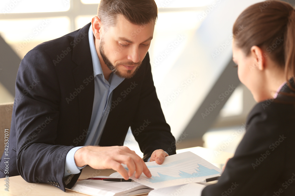 Young managers discussing issues in office Stock-Foto | Adobe Stock