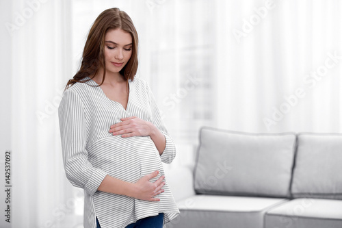 Beautiful pregnant woman re...